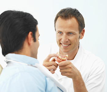 Dr. Daniel Cobb, Alex Bell Dental Image Of Doctor and Patient