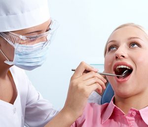 Dr. Daniel Cobb, Alex Bell Dental Image Of Dental Surgeon and a Patient